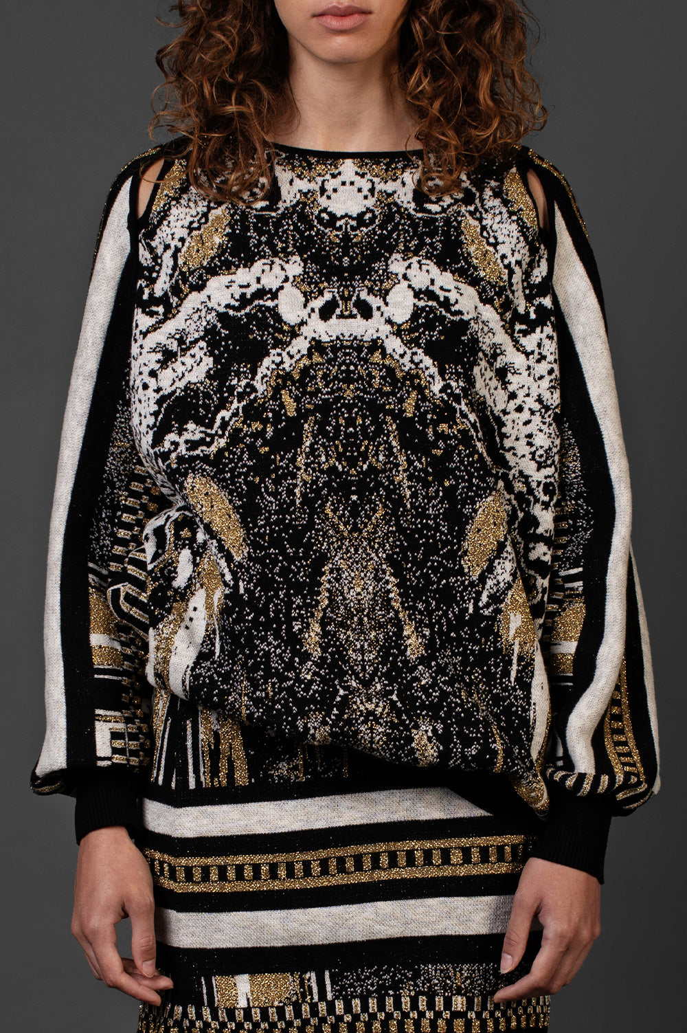 BLACK AND GOLD SWEATER WITH BLACK CUT OUT PIPPING DETAIL image 0