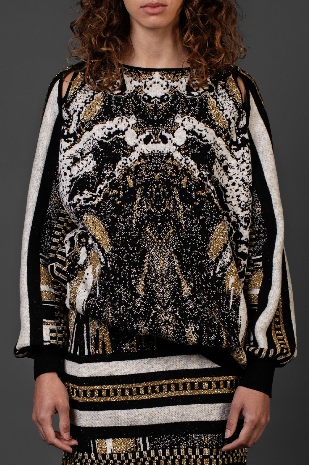 BLACK AND GOLD SWEATER WITH BLACK CUT OUT PIPPING DETAIL